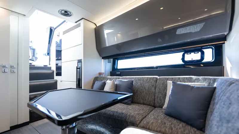 G-jazss Yacht Photos Pics Luxurious interior of 2022 Azimut Verve 47 yacht with modern seating and sleek design.