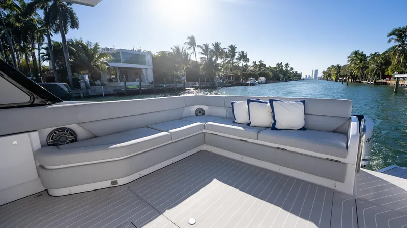 G-jazss Yacht Photos Pics Luxurious seating area on 2022 Azimut Verve 47 yacht, with scenic waterfront view.