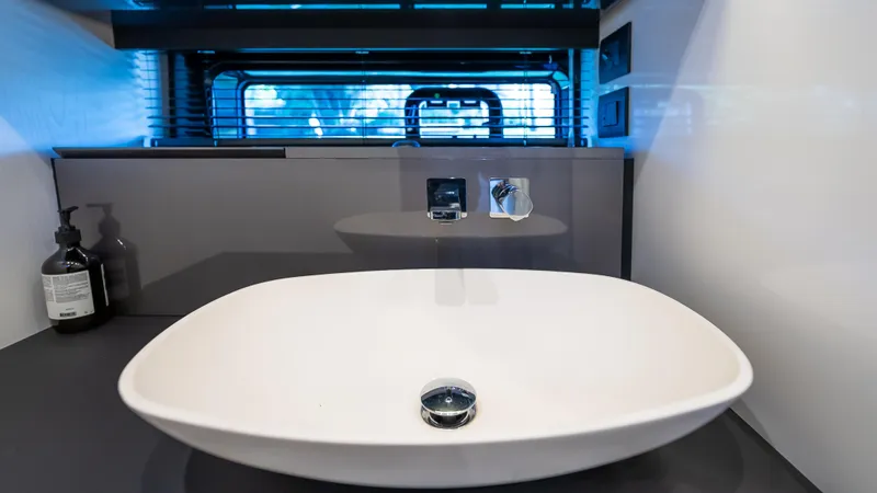 G-jazss Yacht Photos Pics Modern bathroom sink on 2022 Azimut Verve 47 yacht, featuring sleek design and contemporary fixtures.