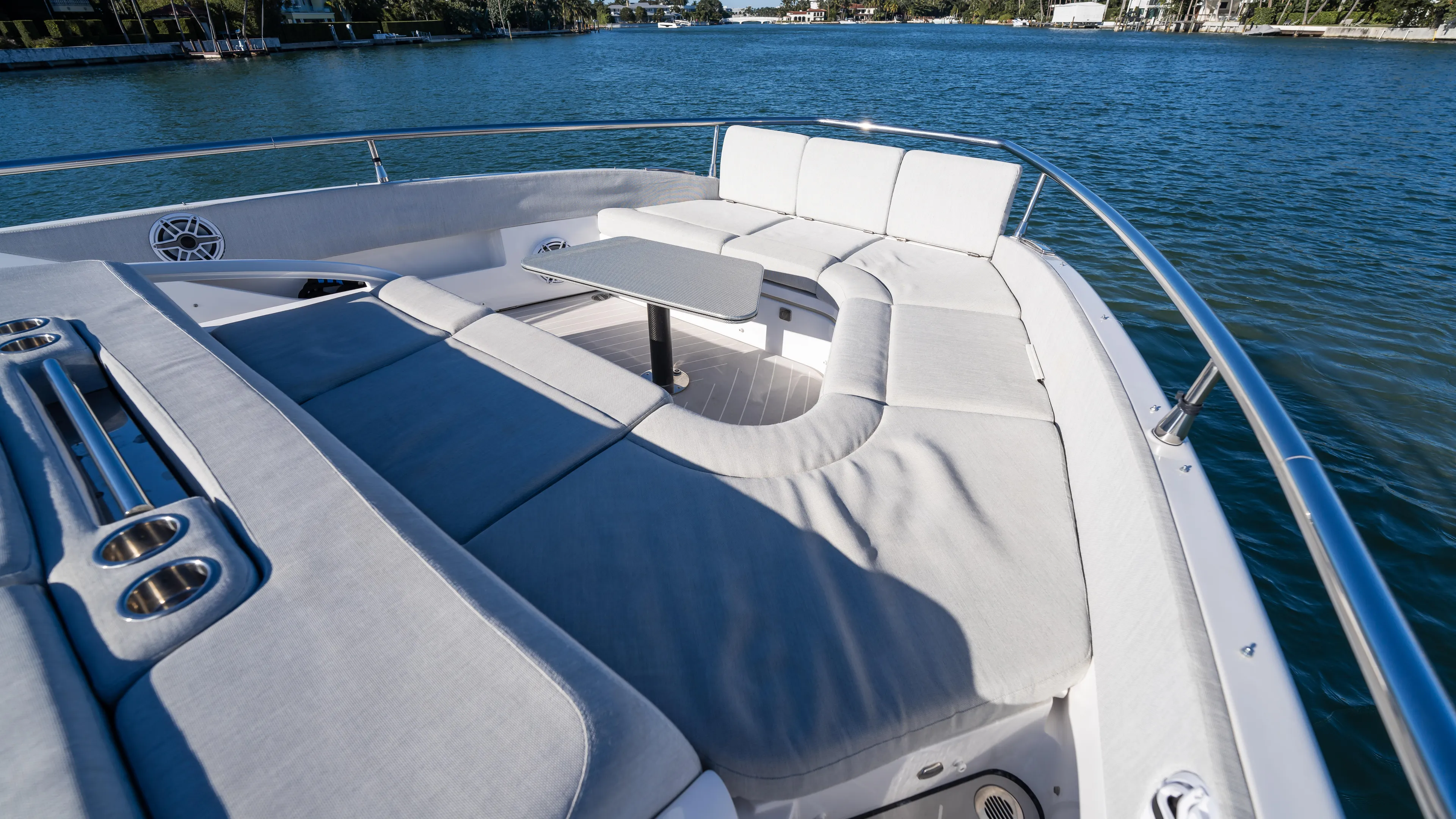 G-jazss Yacht Photos Pics 2022 Azimut Verve 47 yacht with luxurious seating and table on deck, overlooking serene waters.