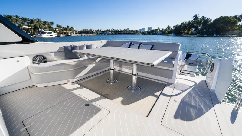 G-jazss Yacht Photos Pics Luxury seating area on 2022 Azimut Verve 47 yacht, overlooking serene waterfront.