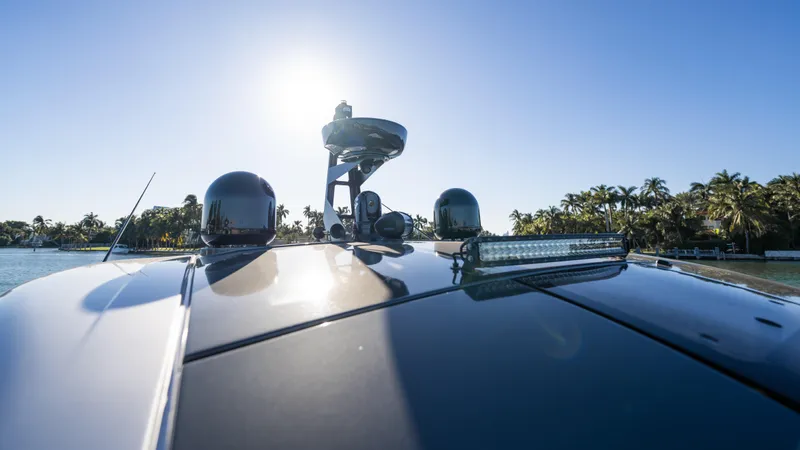 G-jazss Yacht Photos Pics 2022 Azimut Verve 47 yacht on sunny day, sleek design, palm trees in background.