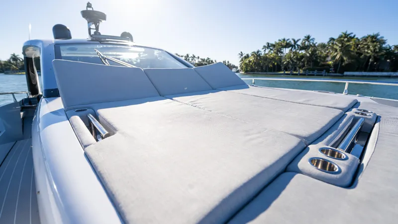 G-jazss Yacht Photos Pics 2022 Azimut Verve 47 yacht with sun deck, surrounded by water and palm trees.