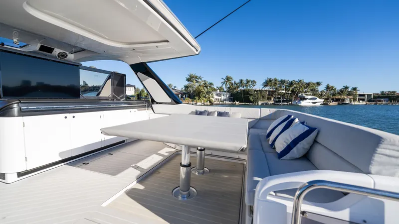 G-jazss Yacht Photos Pics Luxurious 2022 Azimut Verve 47 yacht interior with elegant seating and scenic waterfront view.