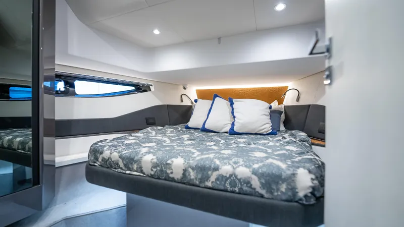 G-jazss Yacht Photos Pics Luxurious cabin interior of 2022 Azimut Verve 47 yacht with cozy bedding.