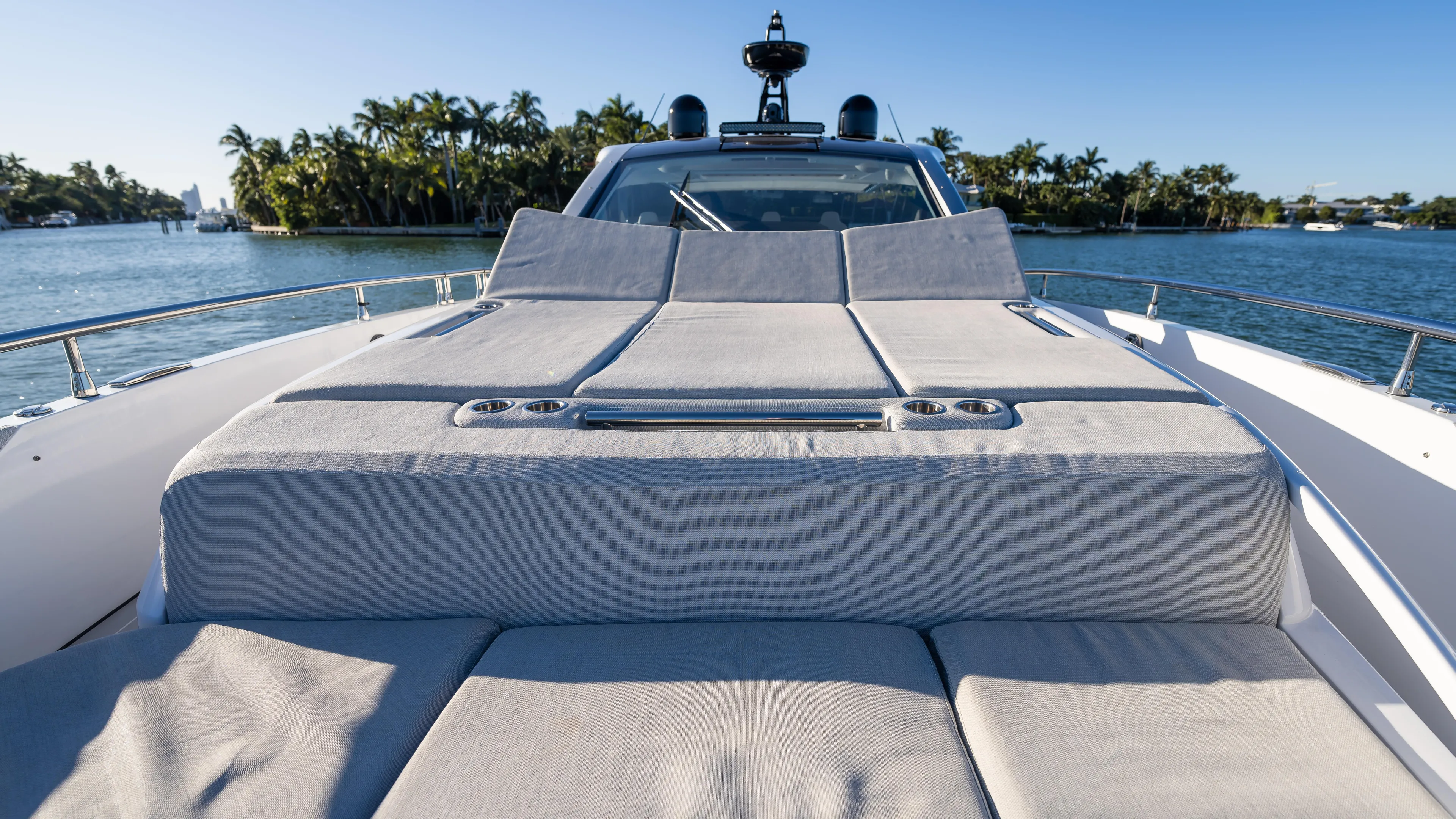 G-jazss Yacht Photos Pics 2022 Azimut Verve 47 yacht with luxurious sunbathing deck, set against a serene waterfront backdrop.