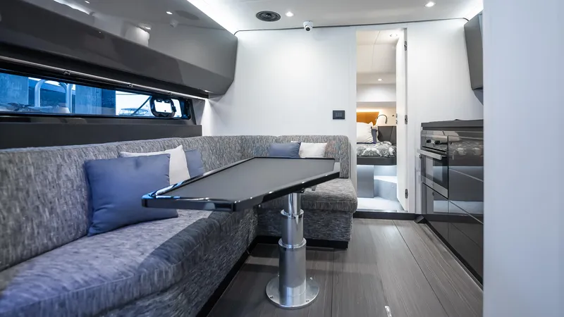 G-jazss Yacht Photos Pics Luxurious interior of 2022 Azimut Verve 47 yacht with modern seating and sleek design.