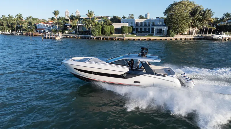 G-jazss Yacht Photos Pics 2022 Azimut Verve 47 yacht cruising on a scenic waterfront.