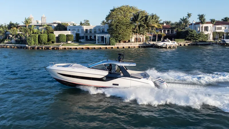 G-jazss Yacht Photos Pics 2022 Azimut Verve 47 yacht cruising near luxury waterfront homes.