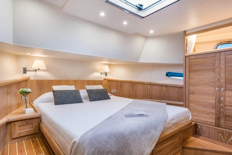 Sasga Yachts 68 Flybridge Yacht Photos Pics Luxurious cabin interior of 2026 Sasga Yachts Menorquin 68 FB with elegant wood finish.