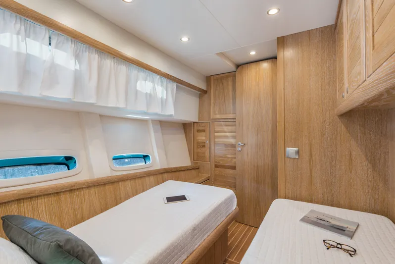 Sasga Yachts 68 Flybridge Yacht Photos Pics Luxurious cabin interior of 2026 Sasga Yachts Menorquin 68 FB with wooden finishes.