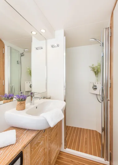 Sasga Yachts 68 Flybridge Yacht Photos Pics Luxurious bathroom in 2026 Sasga Yachts Menorquin 68 FB with modern fixtures and wooden accents.