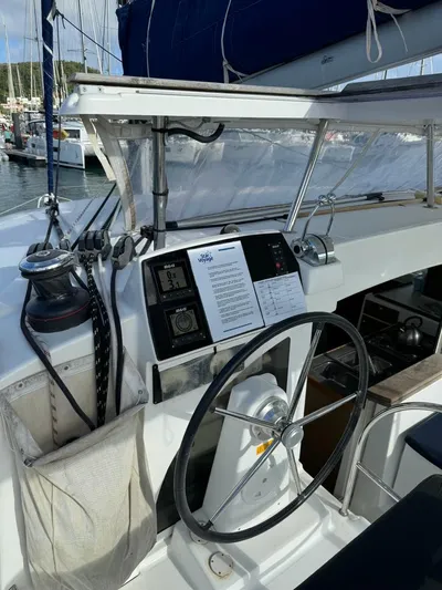 Oscar III Yacht Photos Pics Helm of 2018 Lagoon 380 catamaran with navigation instruments and steering wheel.