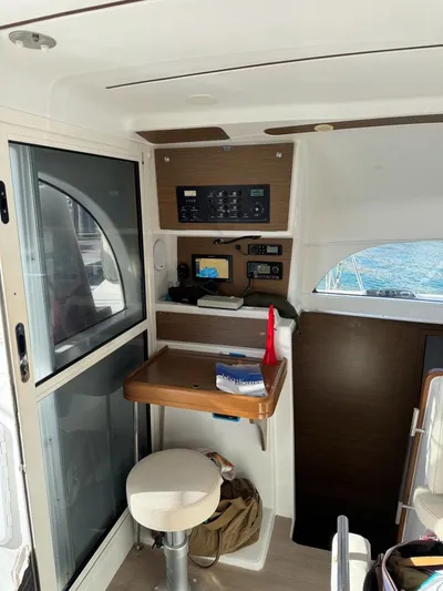 Oscar III Yacht Photos Pics Interior of 2018 Lagoon 380 catamaran with navigation equipment and seating area.