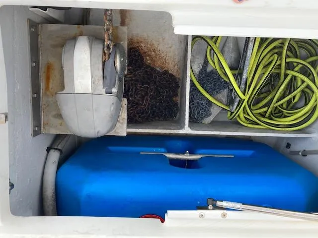 Oscar III Yacht Photos Pics Storage compartment of 2018 Lagoon LAGOON 380 with anchor chain, ropes, and blue tank.