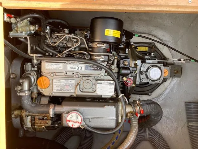 Oscar III Yacht Photos Pics Engine compartment of a 2018 Lagoon LAGOON 380 catamaran, showcasing mechanical components.