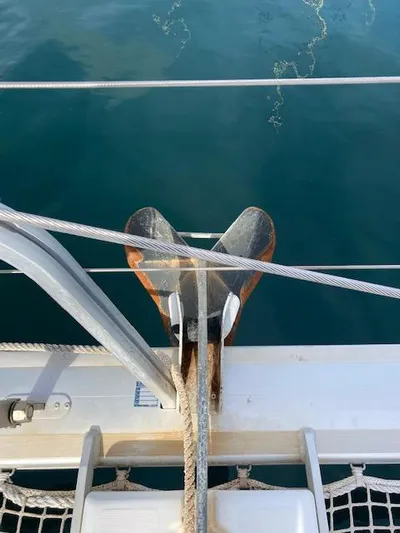 Oscar III Yacht Photos Pics Anchor on Lagoon 380 catamaran, 2018 model, secured on deck with visible ropes.