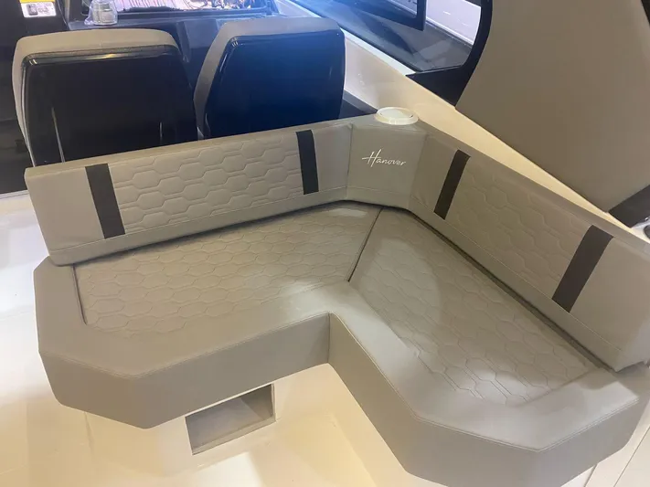  Yacht Photos Pics Luxurious seating in a 2025 Hanover 387 boat, featuring modern design and comfort.