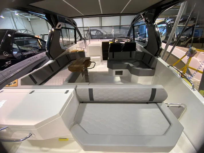  Yacht Photos Pics Interior of 2025 Hanover 387 boat with modern seating and sleek design.
