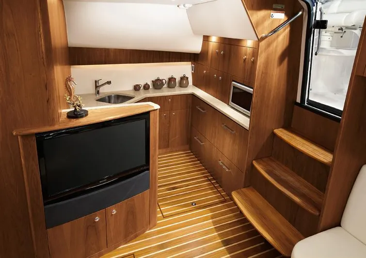 Fifth Case Yacht Photos Pics Manufacturer Provided Image: 2016 Tiara Yachts 4300 Open interior with wooden cabinetry and modern amenities.