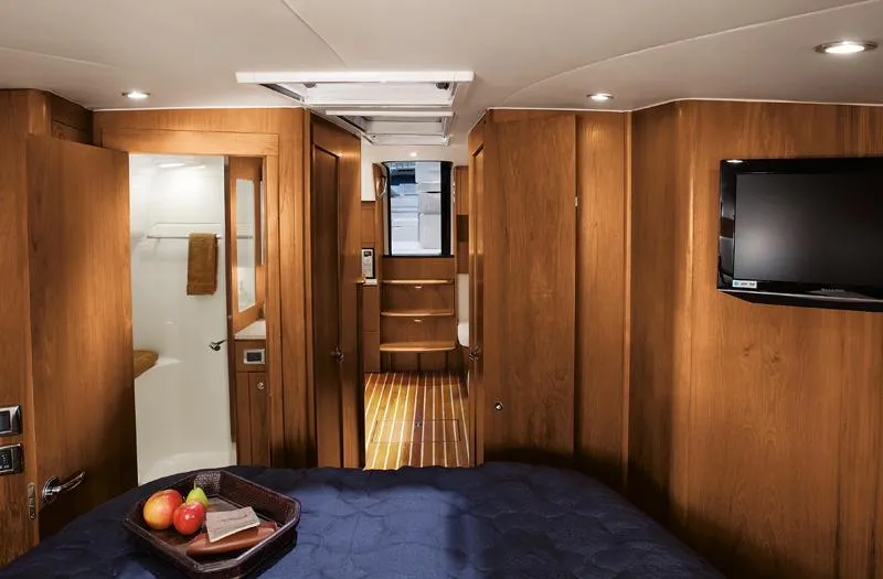 Fifth Case Yacht Photos Pics Manufacturer Provided Image: Luxurious interior of 2016 Tiara Yachts 4300 Open with wood paneling and modern amenities.