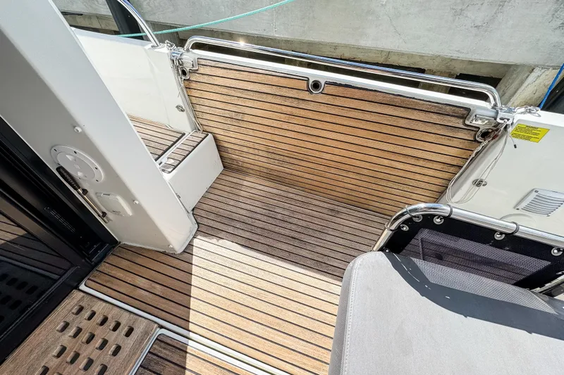  Yacht Photos Pics Teak deck of 2022 Beneteau Antares 11 boat, featuring sleek design and modern finish.