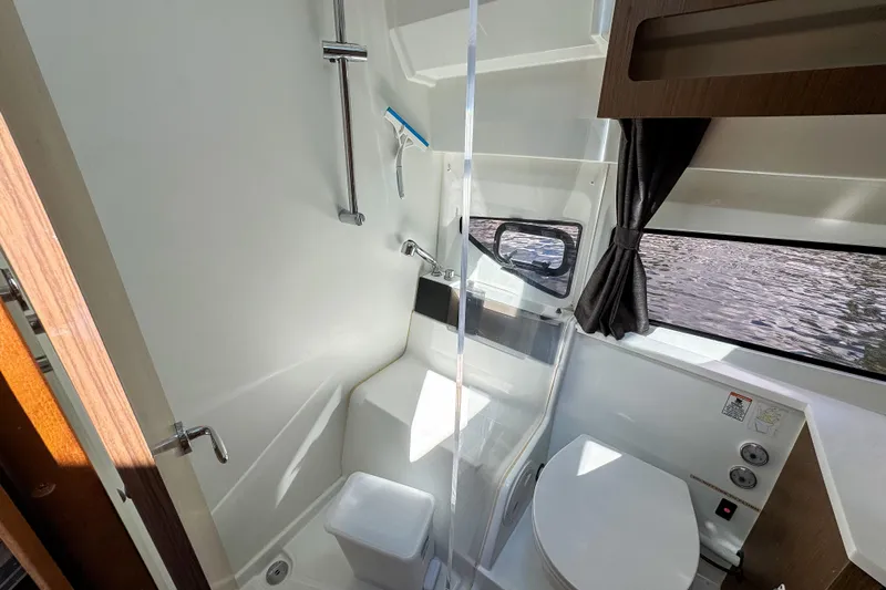  Yacht Photos Pics Modern bathroom interior of 2022 Beneteau Antares 11 boat with shower and toilet.