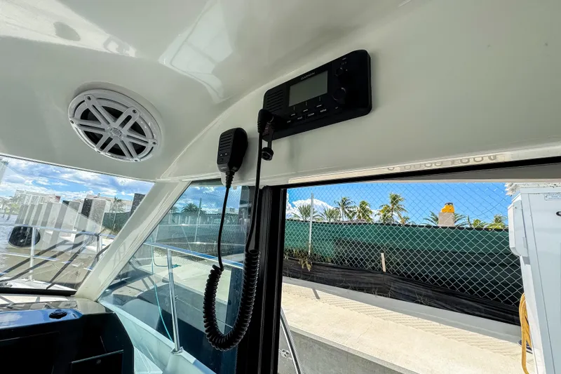  Yacht Photos Pics Interior view of 2022 Beneteau Antares 11 boat with communication equipment and speaker.