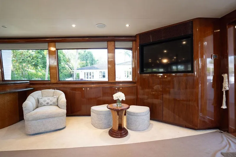  Yacht Photos Pics Luxurious interior of 2004 Cheoy Lee 84 Bravo Flybridge yacht with elegant seating and large windows.