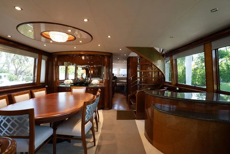  Yacht Photos Pics Luxurious interior of 2004 Cheoy Lee 84 Bravo Flybridge yacht with elegant dining area.