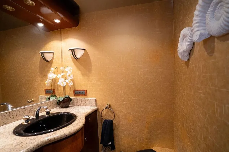  Yacht Photos Pics Luxurious bathroom interior on 2004 Cheoy Lee 84 Bravo Flybridge yacht, featuring elegant fixtures.