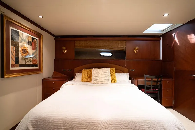  Yacht Photos Pics Luxurious bedroom in 2004 Cheoy Lee 84 Bravo Flybridge yacht with elegant decor.
