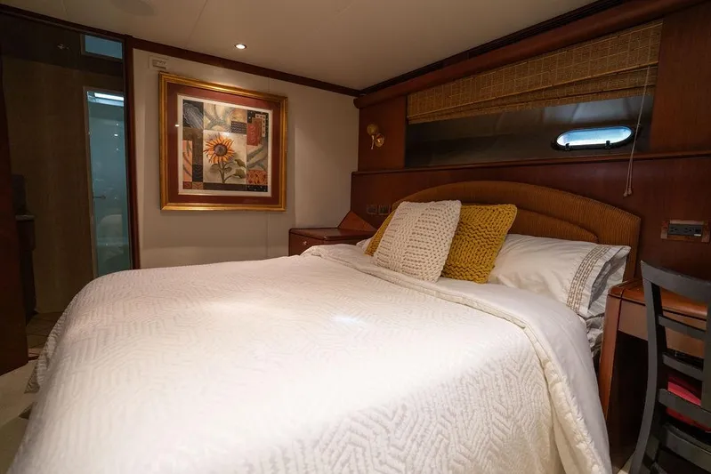  Yacht Photos Pics Luxurious bedroom in 2004 Cheoy Lee 84 Bravo Flybridge yacht with elegant decor.