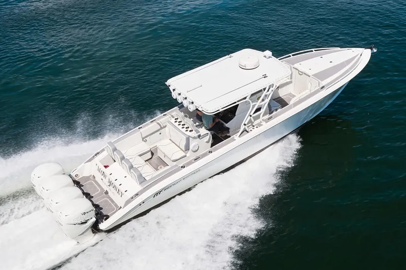  Yacht Photos Pics 2007 Midnight Express Cuddy boat cruising on open water, aerial view.