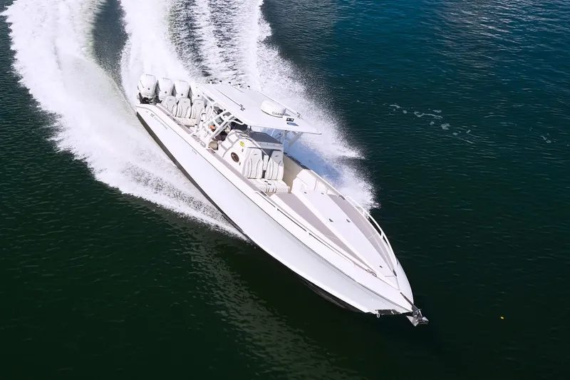  Yacht Photos Pics 2007 Midnight Express Cuddy boat cruising swiftly on open water.