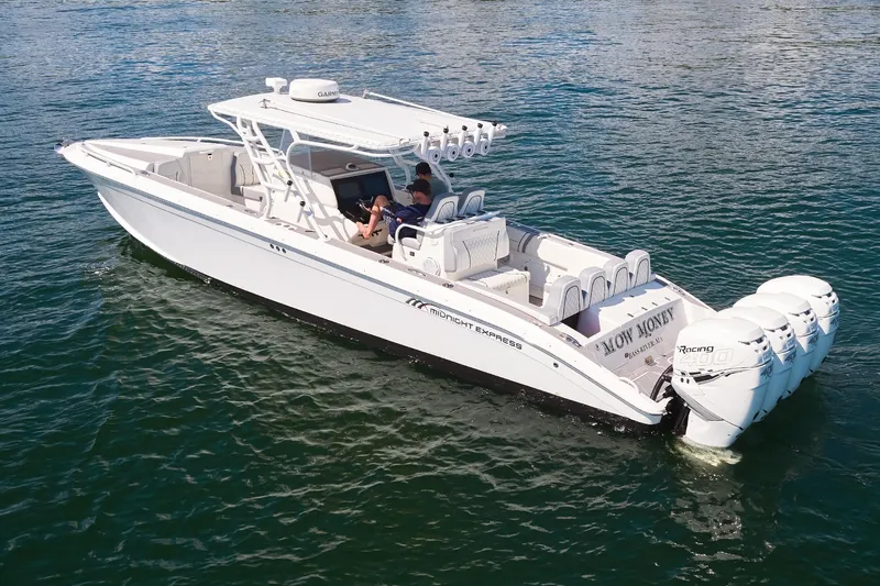  Yacht Photos Pics 2007 Midnight Express Cuddy boat on water, featuring multiple outboard engines.