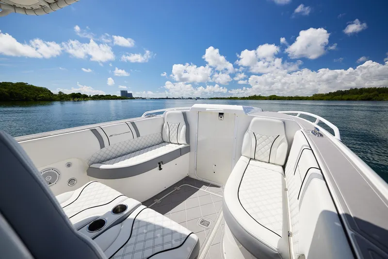  Yacht Photos Pics 2007 Midnight Express Cuddy boat interior with luxurious seating on a sunny day.