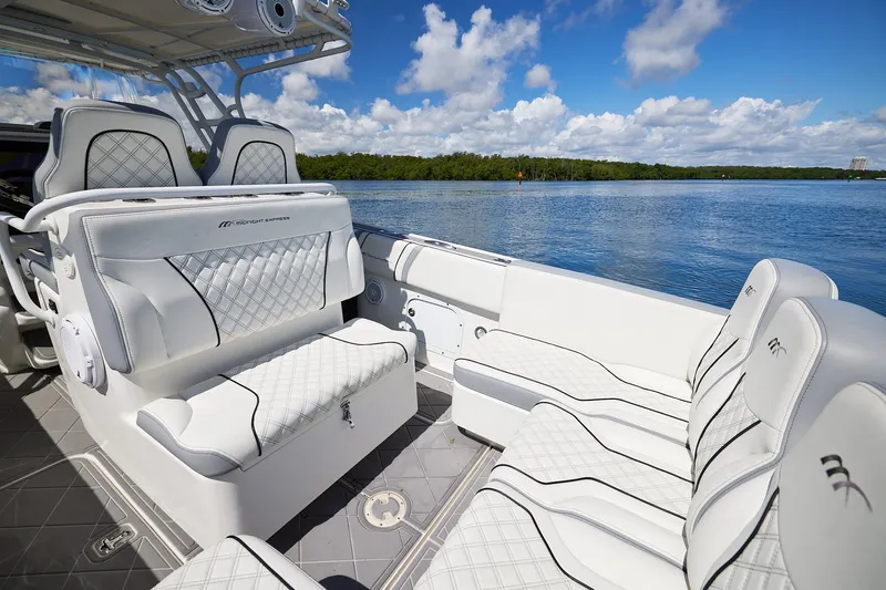  Yacht Photos Pics Luxurious 2007 Midnight Express Cuddy boat interior with plush seating and scenic water view.