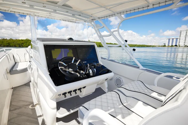  Yacht Photos Pics 2007 Midnight Express Cuddy boat interior with modern navigation system and luxurious seating.