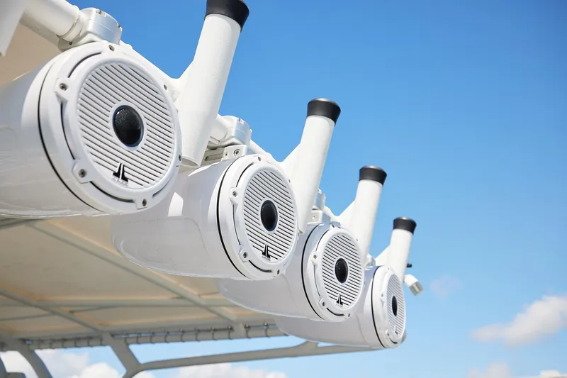  Yacht Photos Pics Speakers and rod holders on a 2007 Midnight Express Cuddy boat against blue sky.