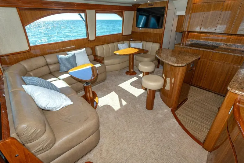 Stay Salty Yacht Photos Pics Luxurious interior of 2009 Viking 50 Convertible yacht with plush seating and ocean view.