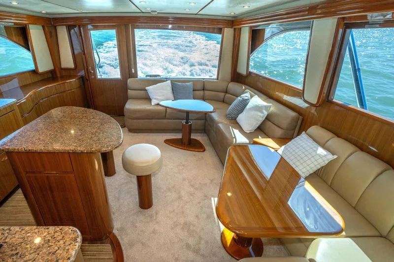 Stay Salty Yacht Photos Pics Luxurious interior of 2009 Viking 50 Convertible yacht with elegant seating and ocean view.