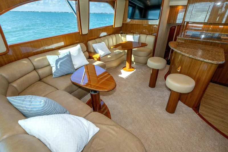 Stay Salty Yacht Photos Pics Luxurious interior of 2009 Viking 50 Convertible yacht with plush seating and ocean view.