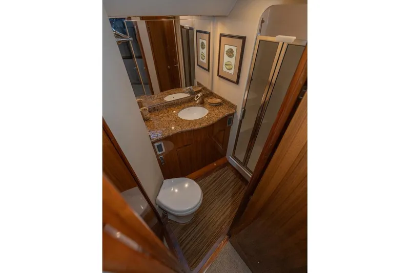 Stay Salty Yacht Photos Pics Luxurious bathroom in 2009 Viking 50 Convertible yacht with granite countertop and shower.