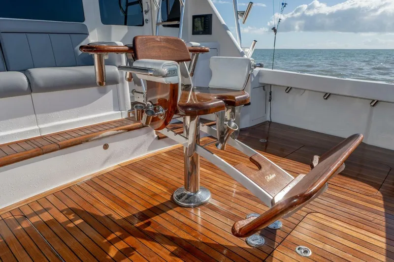 Stay Salty Yacht Photos Pics Luxury fishing chair on 2009 Viking 50 Convertible yacht with polished wood deck.