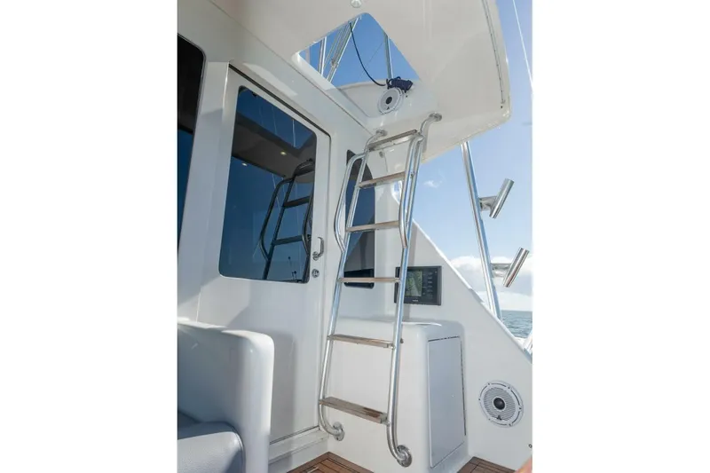 Stay Salty Yacht Photos Pics 2009 Viking 50 Convertible yacht interior with ladder and ocean view.