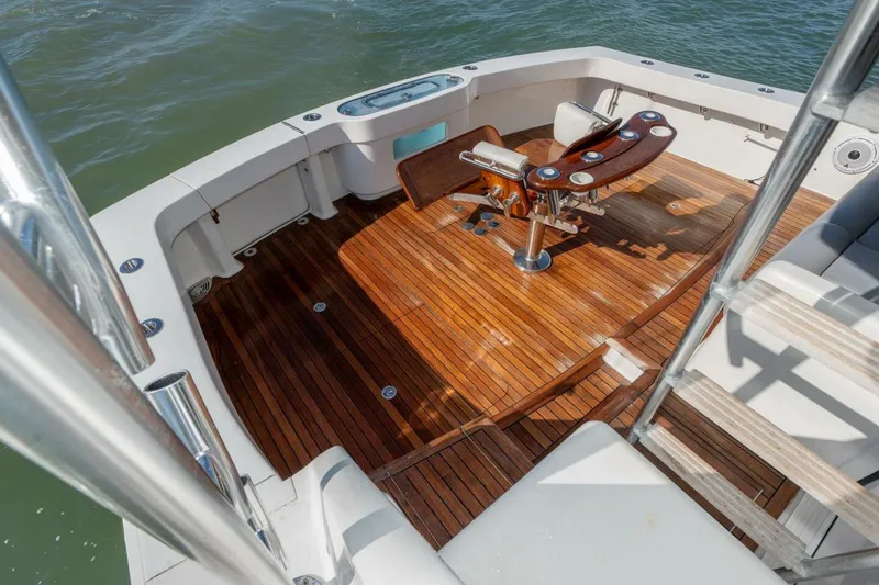 Stay Salty Yacht Photos Pics 2009 Viking 50 Convertible yacht deck with wooden flooring and fishing chair.