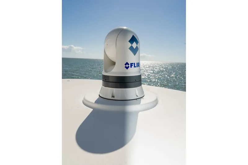 Stay Salty Yacht Photos Pics FLIR camera on 2009 Viking 50 Convertible yacht, overlooking ocean under clear sky.