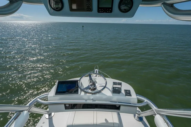 Stay Salty Yacht Photos Pics Helm view of 2009 Viking 50 Convertible yacht on open water.