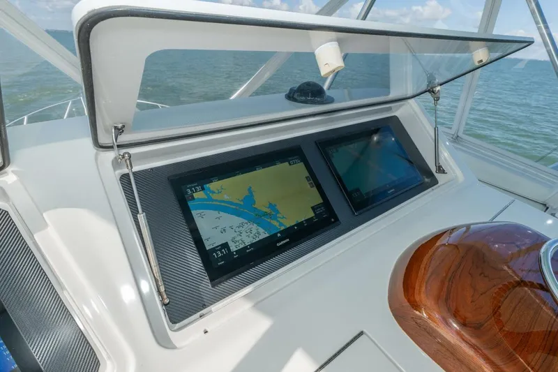 Stay Salty Yacht Photos Pics Control panel of 2009 Viking 50 Convertible yacht with navigation screens.